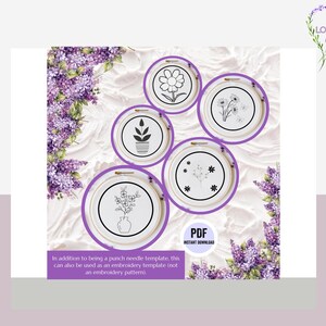 May include: Five black and white floral embroidery patterns in hoop frames. The patterns include a single flower, a bouquet of flowers, a flower in a pot, a single flower with leaves, and a flower with a stem and leaves. The background is a white textured surface with purple flowers.