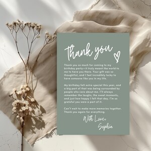 May include: A thank you card with a green background and white text. The card says "Thank you" with a heart symbol and a message expressing gratitude for attending a birthday party. The card is signed "With Love, Sophia."