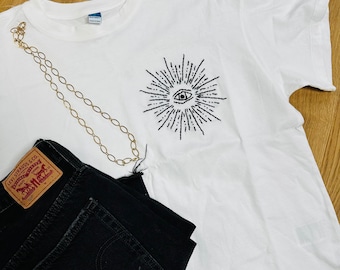 Hand embroidered sun evil eye shirt, short sleeve tee, astrology t-shirt, minimalist, embroidery, Afghan maker, Afghanistan, Bibi Collective