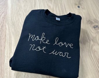 hand embroidered anti war black short sleeve t-shirt, embroider peace, lingua franca, make love not war, eco clothing, refugee woman made