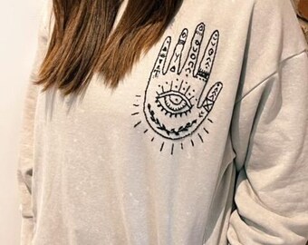 Hand embroidered Hamsa gray crewneck sweatshirt, evil eye embroidery, spiritual, Afghan refugee maker, Bibi Collective, organic cotton, luck