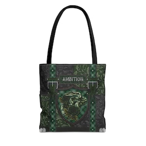 May include: A green and black tote bag with a snake design and the word "AMBITION" on the front.