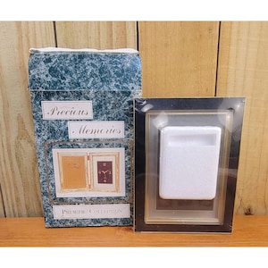 May include: A set of three ceramic mugs with a speckled, matte finish. The mugs are in shades of cream, light gray, and dark gray. Each mug has a simple, minimalist design, perfect for coffee or tea.