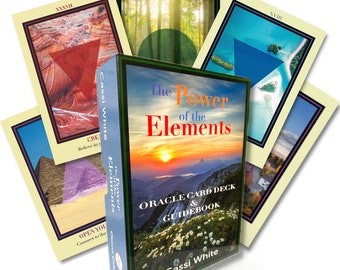 May include: A boxed oracle card deck and guidebook titled "The Power of the Elements" by Cassi White. The box features a sunset over a mountain range. The cards are visible in the background, with images of nature and geometric shapes.