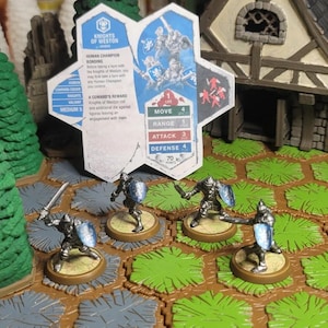 May include: Miniature figurines of armored knights with swords and shields on a hexagonal game board. The game board has a brown and green color scheme. A card with game statistics and the text "Knights of Weston" is also visible.