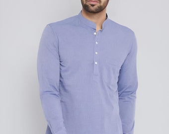 May include: A pale blue long-sleeved shirt with a mandarin collar and a pocket on the left chest. The shirt features a button-down placket and a curved hem. The shirt is made of a lightweight fabric.