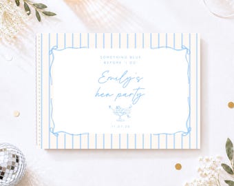 May include: A rectangular spiral-bound notebook with a cream and light blue vertical striped cover. The centre features a white rectangular frame with blue text reading Something Blue Before I Do, Emily's hen party, and 11.07.26.