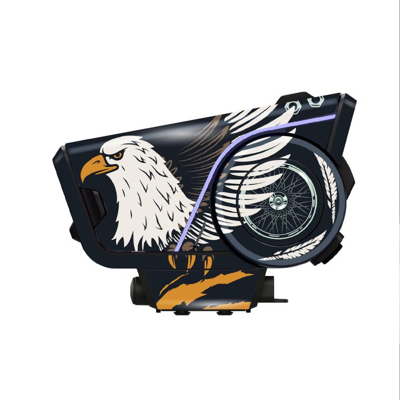 May include: A black and orange device with an eagle design. The device features a white eagle head with a yellow beak and a wing design. The device has a circular wheel design on the side and a purple accent line.