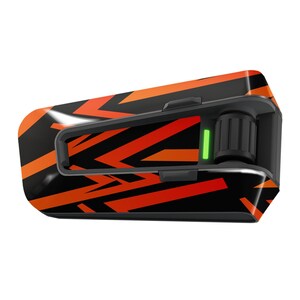 May include: A black and orange motorcycle communication device with a green light indicator. The device has a textured, geometric pattern.