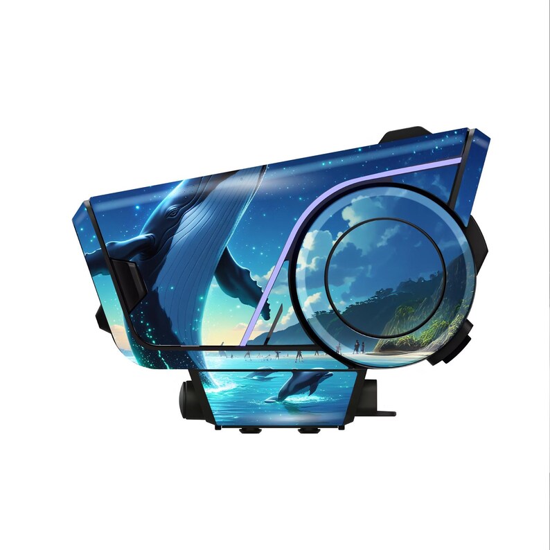 May include: A black and blue electronic device with a whale and ocean scene design. The device features a large blue whale, a starry sky, and a beach scene with dolphins. The design is detailed and artistic, with a circular element on the side.