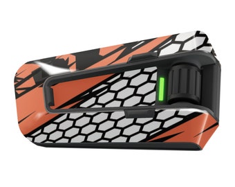 May include: A black and orange motorcycle helmet communication device with a honeycomb pattern and a green light indicator.