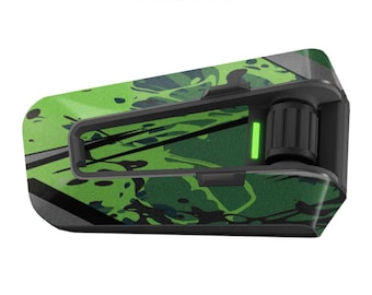 May include: A green and black patterned motorcycle communication device with a matte finish. The device has a small green light on the side.