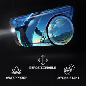 May include: A black and blue electronic device with a whale illustration on the surface. The device has a circular design element with a landscape scene. The device is waterproof, repositionable, and UV-resistant.
