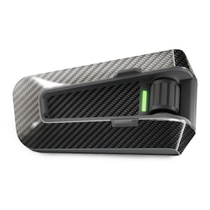 May include: A black and gray motorcycle communication device with a carbon fiber pattern. The device has a green light indicator and a rotating dial.