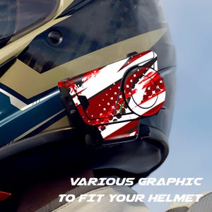 May include: A motorcycle helmet with a communication device attached. The device features a red, white, and black graphic design. The text "VARIOUS GRAPHIC TO FIT YOUR HELMET" is visible at the bottom of the image.