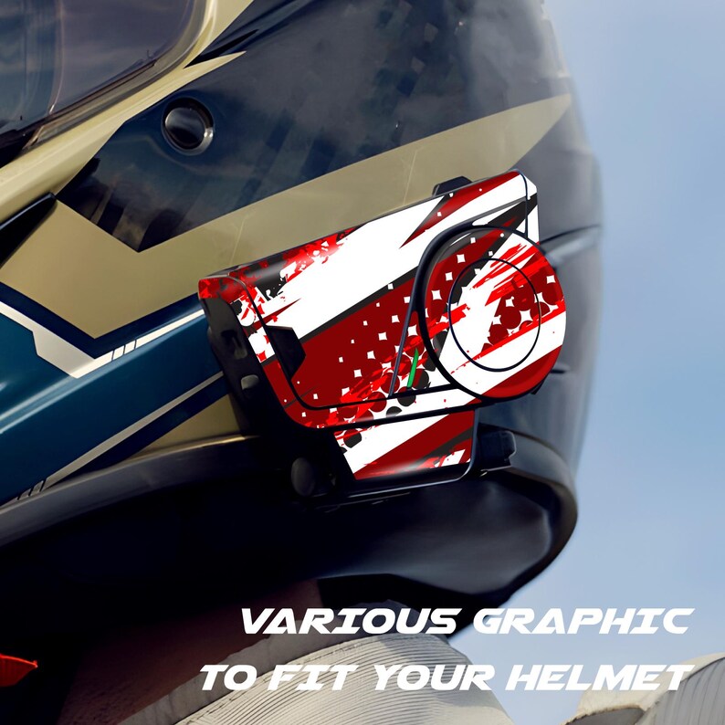 May include: A motorcycle helmet with a communication device attached. The device features a red, white, and black graphic design. The text "VARIOUS GRAPHIC TO FIT YOUR HELMET" is visible at the bottom of the image.