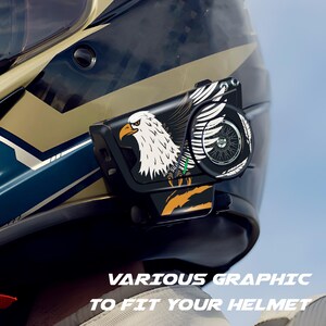 May include: A black motorcycle helmet with a graphic of a bald eagle and a wheel design. The text "VARIOUS GRAPHIC TO FIT YOUR HELMET" is visible at the bottom of the image. The helmet is black, gold, and blue.