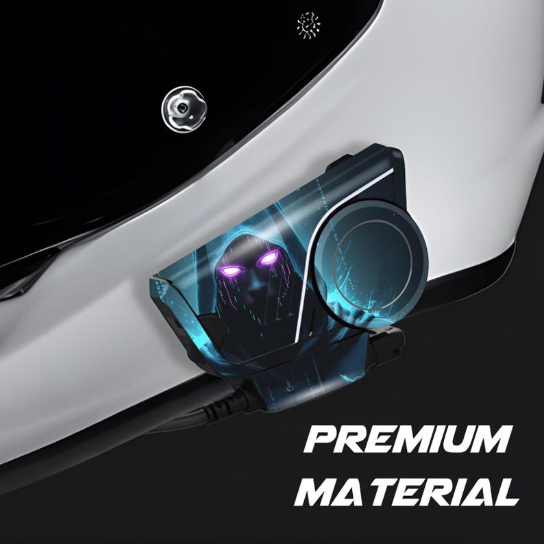 May include: A black and blue device with a graphic of a hooded figure with glowing purple eyes. The device is attached to a white surface, with the words "PREMIUM MATERIAL" in white text.