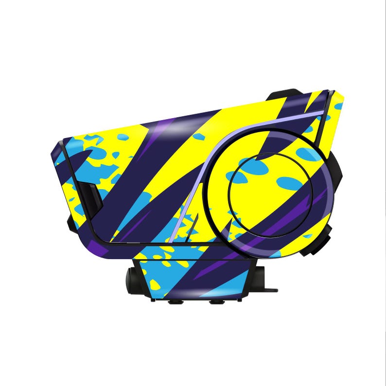 May include: A futuristic device with a vibrant design. It features a combination of yellow, blue, and purple colors in a geometric pattern. The device has a circular element and a rectangular base, suggesting a technological or industrial application.