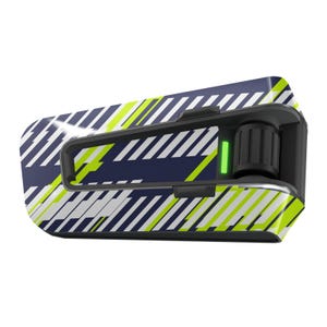 May include: A black and white motorcycle helmet communication system with a green light and a yellow and blue geometric pattern.