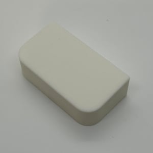May include: A white, rectangular, smooth, plastic block with rounded edges.