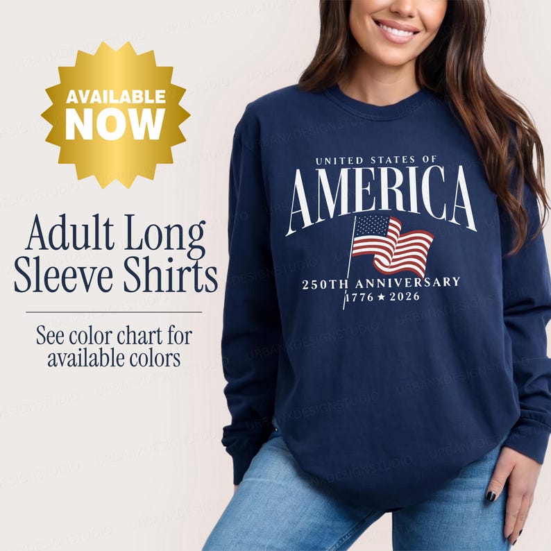 May include: A navy blue long-sleeve shirt featuring the white text UNITED STATES OF AMERICA, a graphic of the American flag, and the text 250TH ANNIVERSARY 1776-2026. The image includes text stating AVAILABLE NOW, Adult Long Sleeve Shirts.