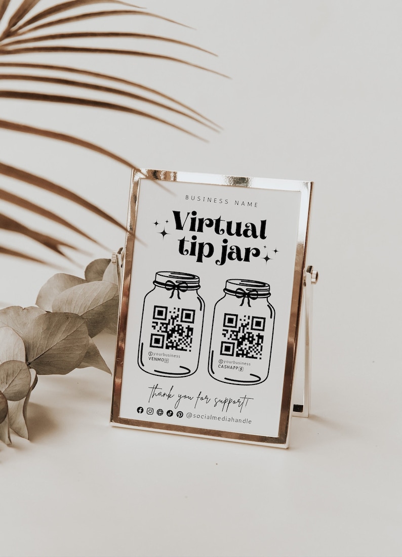 May include: A white sign with a gold frame, with the text "Virtual tip jar+" and two QR codes. The QR codes are labeled "@yourbusiness VENMO" and "@yourbusiness CASHAPP". The sign also includes the text "Thank you for support" and "@socialmediahandle".