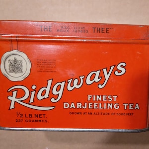 Tin tea box, Vintage Famous red tea box, Ridgways Finest Darjeeling tea merchants to KING GEORGE VI, Queen Vistoria
