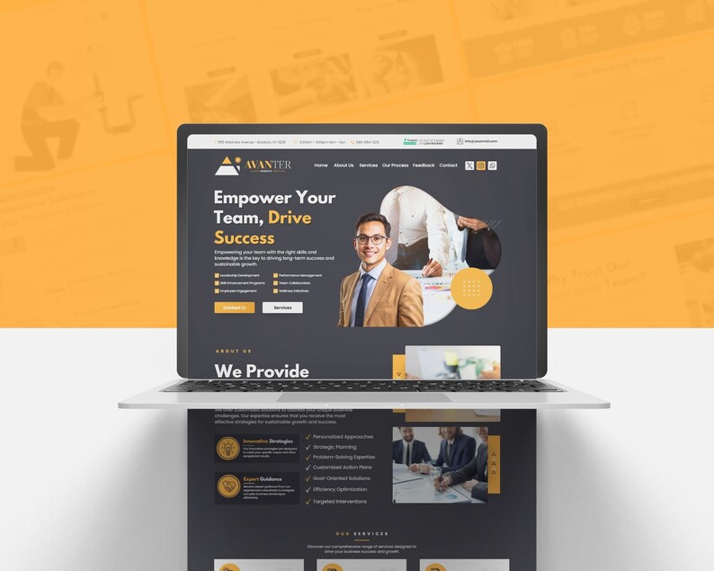 May include: A laptop displaying a website with the text "Empower Your Team, Drive Success." The website features a professional design with a dark gray and yellow color scheme, and includes images of business professionals.