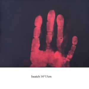 May include: A red handprint on a black background. The handprint is a thermal image, showing the heat of the hand. The image is 14 inches by 17 inches.