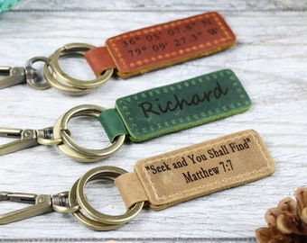 May include: Three leather keychains with different engravings. The first keychain is brown and has coordinates engraved on it. The second keychain is green and has the name "Richard" engraved on it. The third keychain is brown and has the text "Seek and You Shall Find" and "Matthew 7:7" engraved on it.