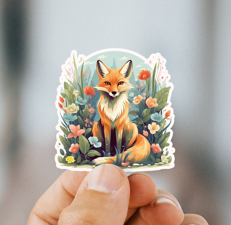 May include: A sticker featuring a red fox sitting in a field of colorful flowers. The fox has a white chest and a bushy tail. The flowers are a variety of colors, including pink, purple, yellow, and blue.