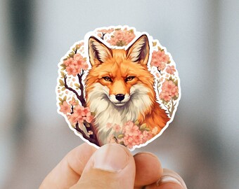 May include: A sticker featuring a red fox with a white chest and a fluffy tail, surrounded by pink and white cherry blossoms.