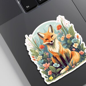 May include: A red fox sits in a field of colorful flowers. The fox has a white chest and a bushy tail. The flowers are in shades of pink, blue, yellow, and orange.