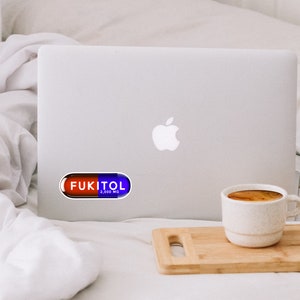 Funny FUKITOL pill-shaped sticker onlaptop
