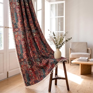 May include: A decorative curtain with a complex pattern in shades of red, teal, and gold. The curtain has a geometric design and is finished with white tassels. The text "GrowHomeDesign" is visible at the bottom left.