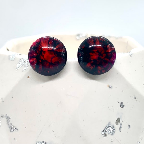 Red and black marble effect studs
