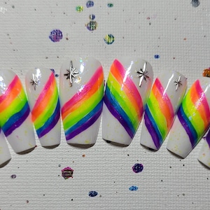 Rainbow glitter nails with silver star charm