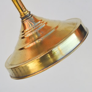 Unlaquered brass shower head, work outdoors