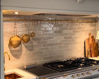 Unlacquered brass pot rail with brass &quot;S&quot; hooks. Solid brass construction. beautiful wall pot rail