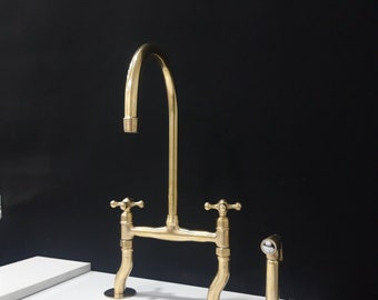 unlacquered brass kitchen bridge faucet with gooseneck spout and Side Sprayer, island pure brass bridge faucet, curved legs faucets