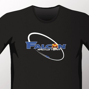 May include: Black t-shirt with a white oval graphic that says "FALCON RACING TEAM" in blue letters. A red and yellow falcon head is inside the oval.