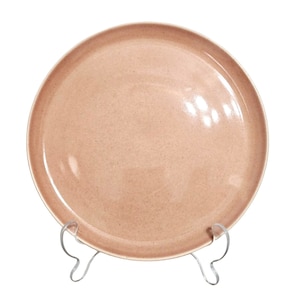 May include: A light pink ceramic dinner plate with a slightly textured surface. The plate is on a clear plastic stand.