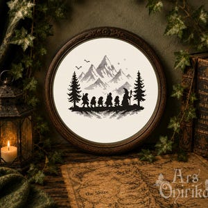 May include: A circular embroidery hoop containing a cross-stitch pattern of a group of six figures walking toward a mountain range, flanked by two pine trees. The design is rendered in black thread on a cream-colored fabric, framed in dark wood.