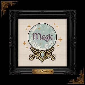 May include: A cross-stitch pattern featuring a light blue crystal ball on a gold stand with the word Magic in dark purple text. The design includes small gold star accents and swirling white clouds inside the sphere, all framed in a black ornate frame.