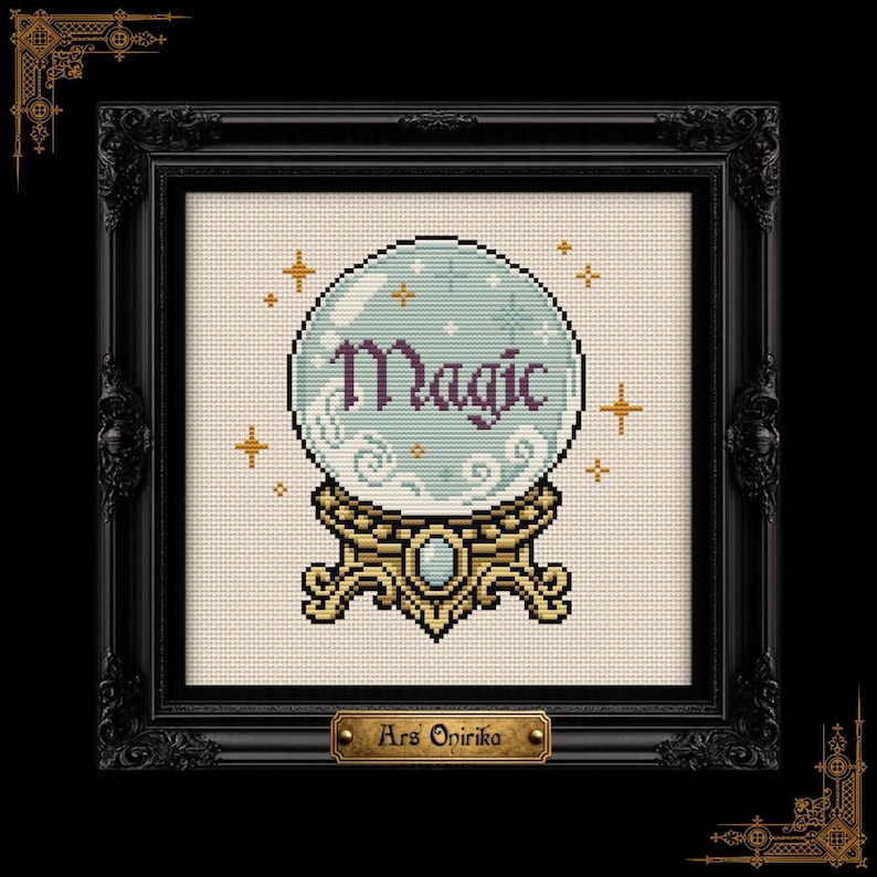 May include: A cross-stitch pattern featuring a light blue crystal ball on a gold stand with the word Magic in dark purple text. The design includes small gold star accents and swirling white clouds inside the sphere, all framed in a black ornate frame.