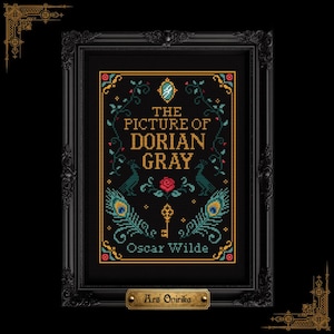 May include: A cross-stitch embroidery of The Picture of Dorian Gray by Oscar Wilde, featuring gold text, a central red rose, two peacocks, peacock feathers, and a key, all framed in a black ornate frame with a small gold plaque reading Ars Onirika.