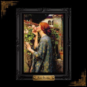May include: A framed cross-stitch embroidery depicting a person with reddish hair in a blue patterned garment smelling pink roses near a stone wall. The black ornate frame features a gold plaque at the bottom with the text Ars Onirika.