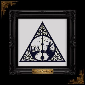 May include: Framed black and white cross-stitch art featuring a dark blue Deathly Hallows symbol. The design includes silhouettes of characters and the text "Ars Opirika" on a small gold plaque.