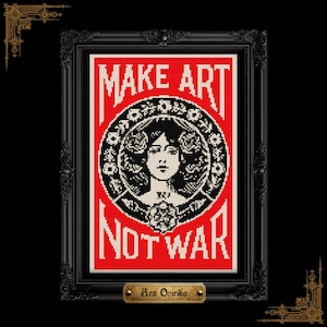 以下が含まれることがあります： 赤い背景に「MAKE ART NOT WAR」の白い文字が描かれた額装されたアートワーク。アートワークは、女性の顔と花の要素を備えた中央の円形デザインを特徴とし、すべて白黒です。フレームは黒です。